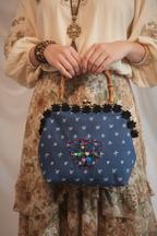 Close-up Woman Holding Tree of Hearts Denim Handbag