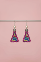 Earrings dangling from bar