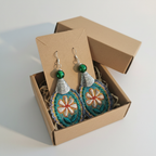 Earrings in a small brown shipping box